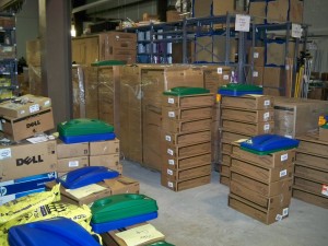 A load of 300 containers & lids arrive in the stock room to be sorted, labeled, and put out into the buildings.