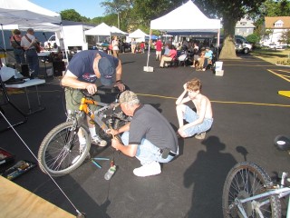 R Community Bikes repair bikes at the Westside Farmers Market