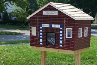 The Little Free Library at the Children's School @ URMC features the handprints of some of the students.