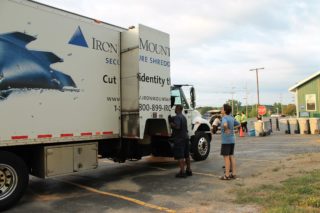A participant witnessing the shredding of her documents on the shred truck's camera.