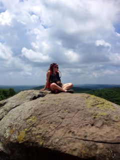 Ainslee sitting on a rock in Shawnee National Forest in Southern Illinois