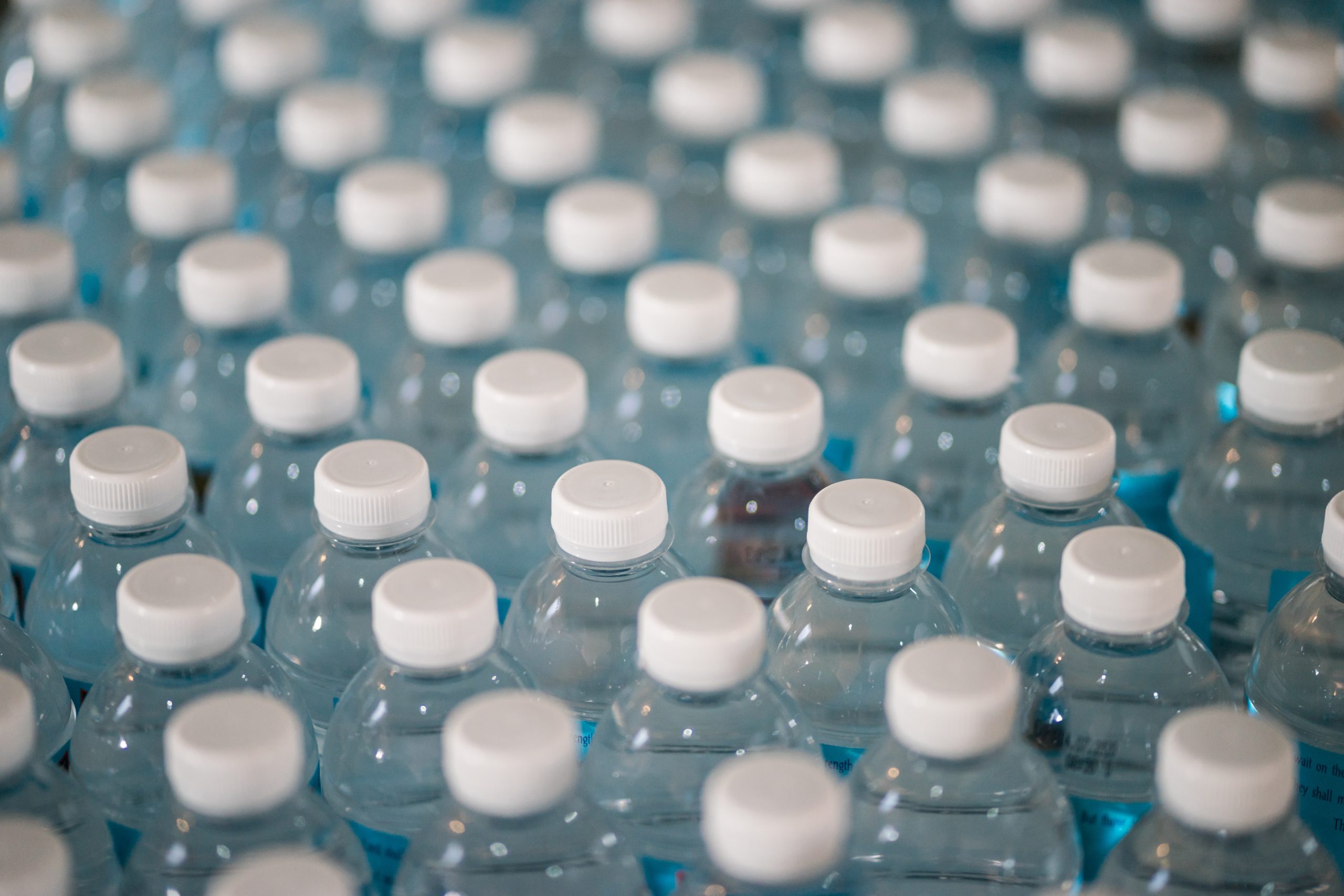 Close up of a large array of plastic water bottles