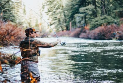 picture of a person fly fishing in a river.