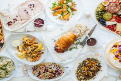 Spread of eye-catching culinary dishes on a white table