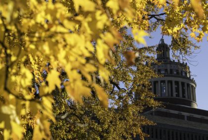 Rush Rhees Library is seen through colored tree leaves change as Fall approaches October 24, 2022. // photo by J. Adam Fenster / University of Rochester